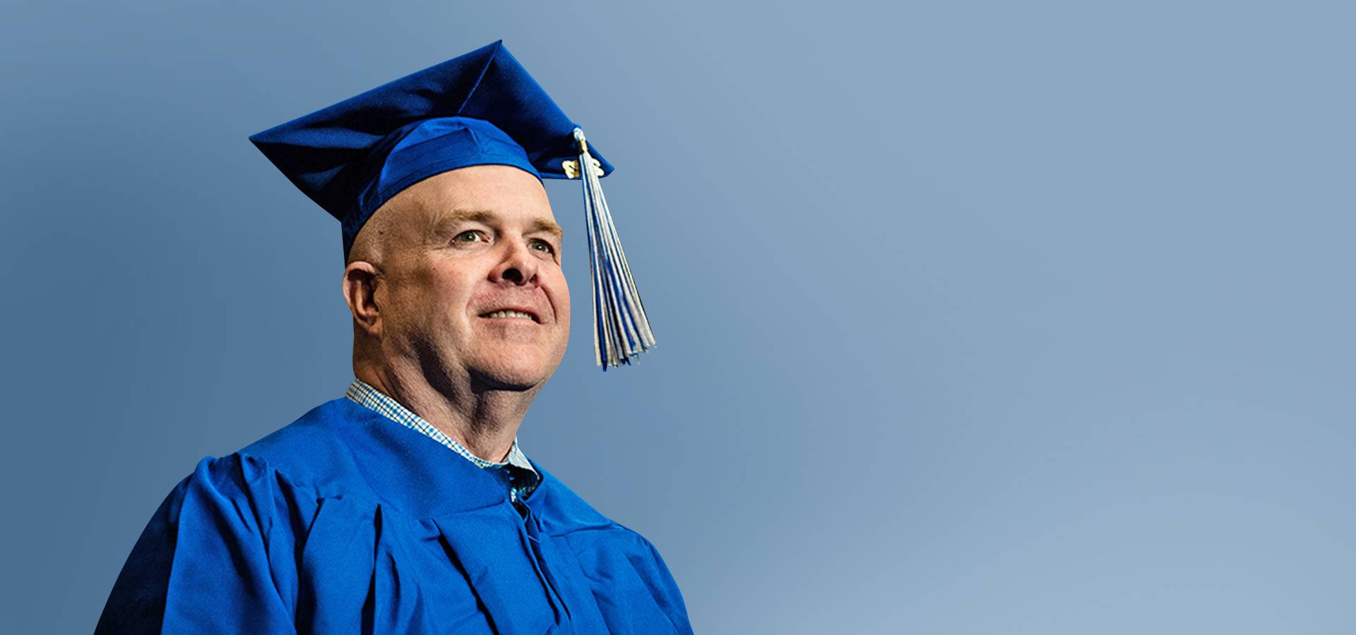 Man in GVSU Cap and Gown